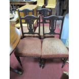 A Set of Four Edwardian Mahogany Chairs, arched top rail, carved and pierced splat, upholstered