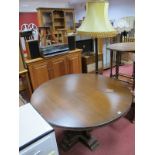 A Late XX Century Stained Hardwood Circular Topped Table, moulded edge, over central shaped pedestal