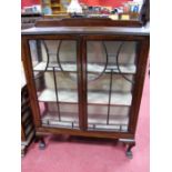 Early XX Century Mahogany Display Cabinet, with a shaped low back, glazed astragal doors, two