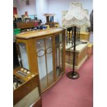 XX Century Oak Bow Fronted Display Cabinet, with glazed doors, together with standard lamp (untested