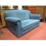 1920's Two Seater Settee, upholstered in a blue velvet on bun feet.