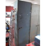 A Metal Storage Cabinet, adjustable shelving, internal labels reads "GR Constructors,