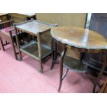 An Early XX Century Occasional Table, shaped oval top, with under tier, a two tier tea trolley and