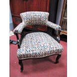 An Edwardian Ebonised Tub Chair, with pierced splats, cabriole legs, upholstered in a checked