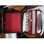 A Galanti Mid XX Century Italian Accordion, with red marbelette casing, in carry case.