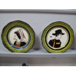 A Pair of Mid XX Century Quimper Portrait Plates, the centre with a lady and gentleman in