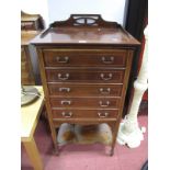 An Edwardian Inlaid Mahogany Music Cabinet, with pierced gallery, five fall front drawers,