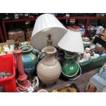 A Large Stoneware Pitcher, another with green streaked glaze; together with three pottery lamp bases