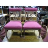 A Pair of Edwardian Parlour Nursing Chairs, each heavily inlaid with angel, florets and swags to