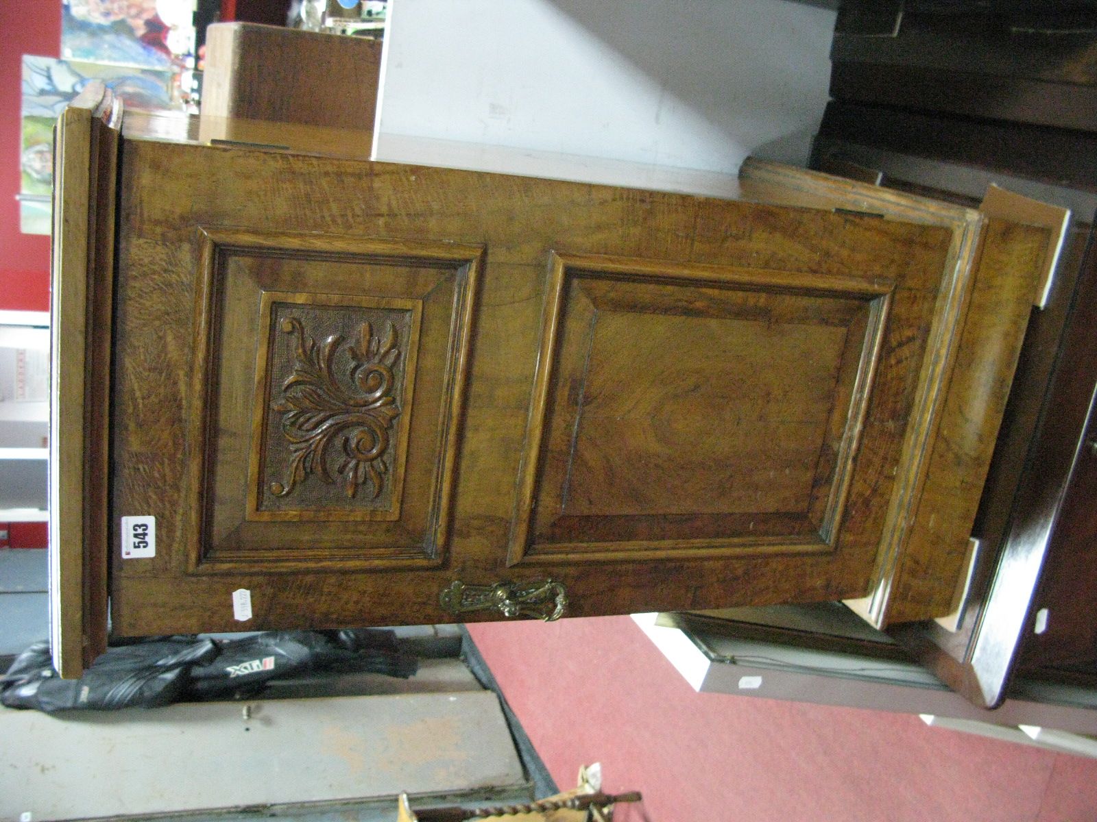 A XIX Century Burr Walnut Bedside Cupboard, with pokerwork carved floral upper panel to brass