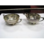 A Matched Hallmarked Silver Jug and Sugar Bowl, each of shallow circular form with reeded detail. (