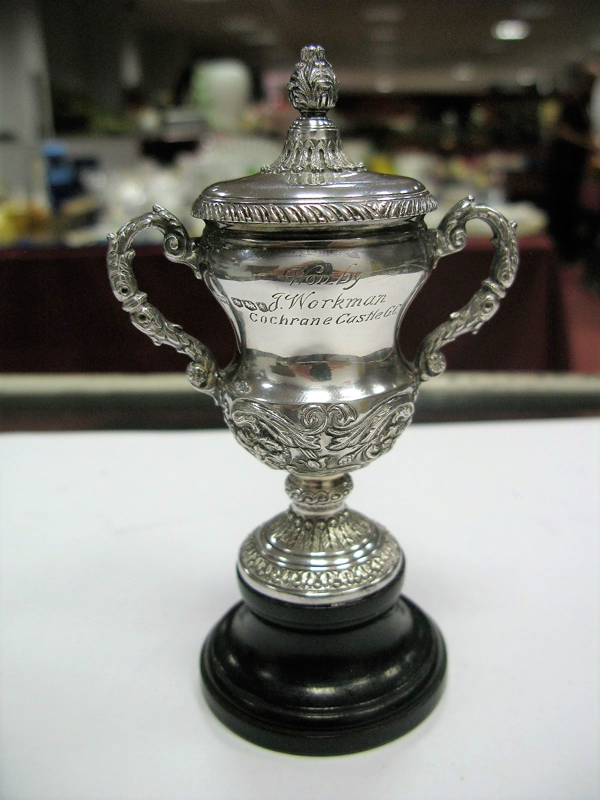 A Hallmarked Silver Miniature Trophy, Mappin & Webb, Sheffield 1936, engraved inscription "Replica