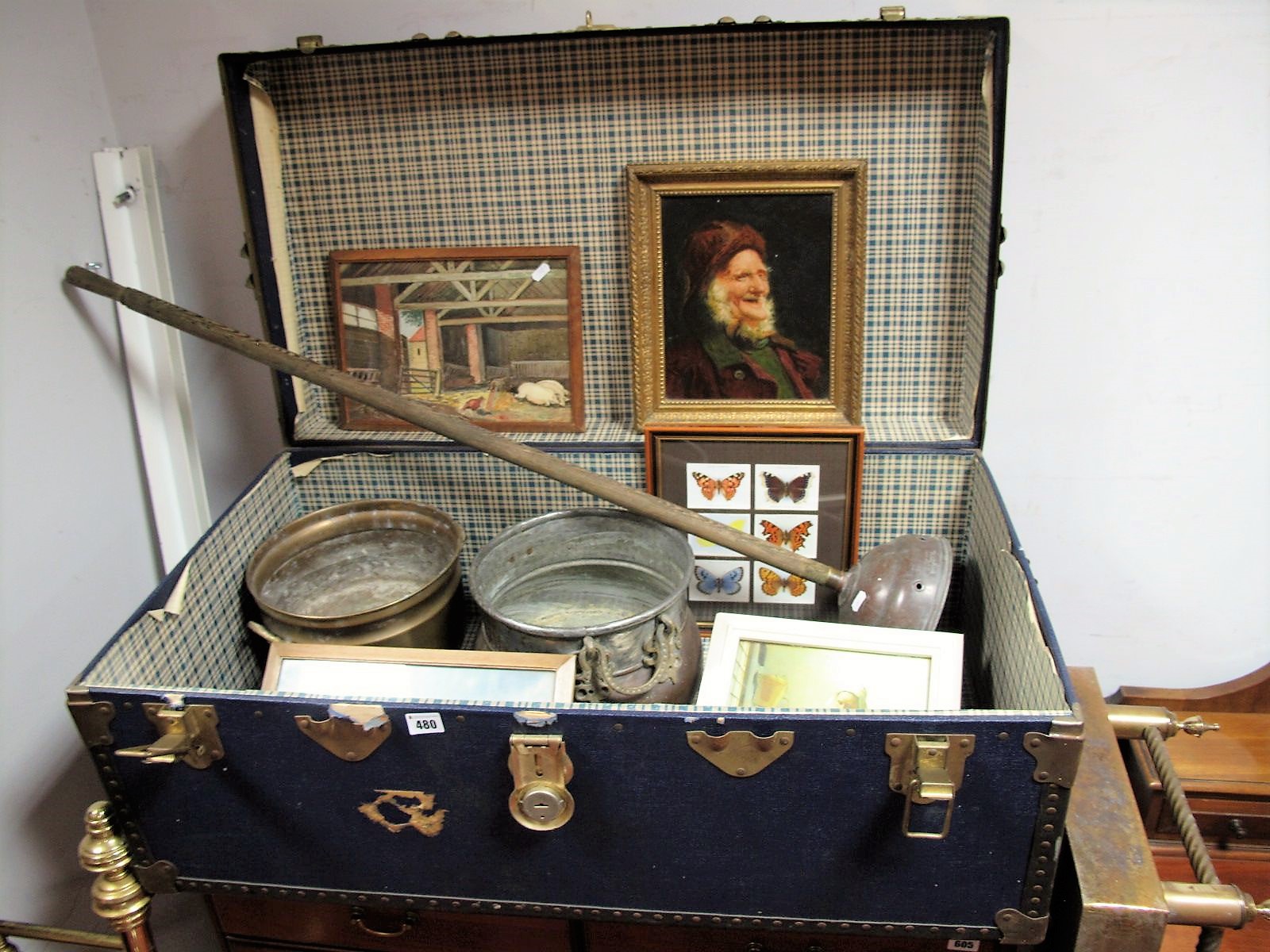 An 'Overpond' Travel trunk, brass fender, brass Jardiniere, copper posher and twin handled pot,