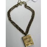 A 9ct Gold Square Ingot Pendant, suspended on double row bracelet.