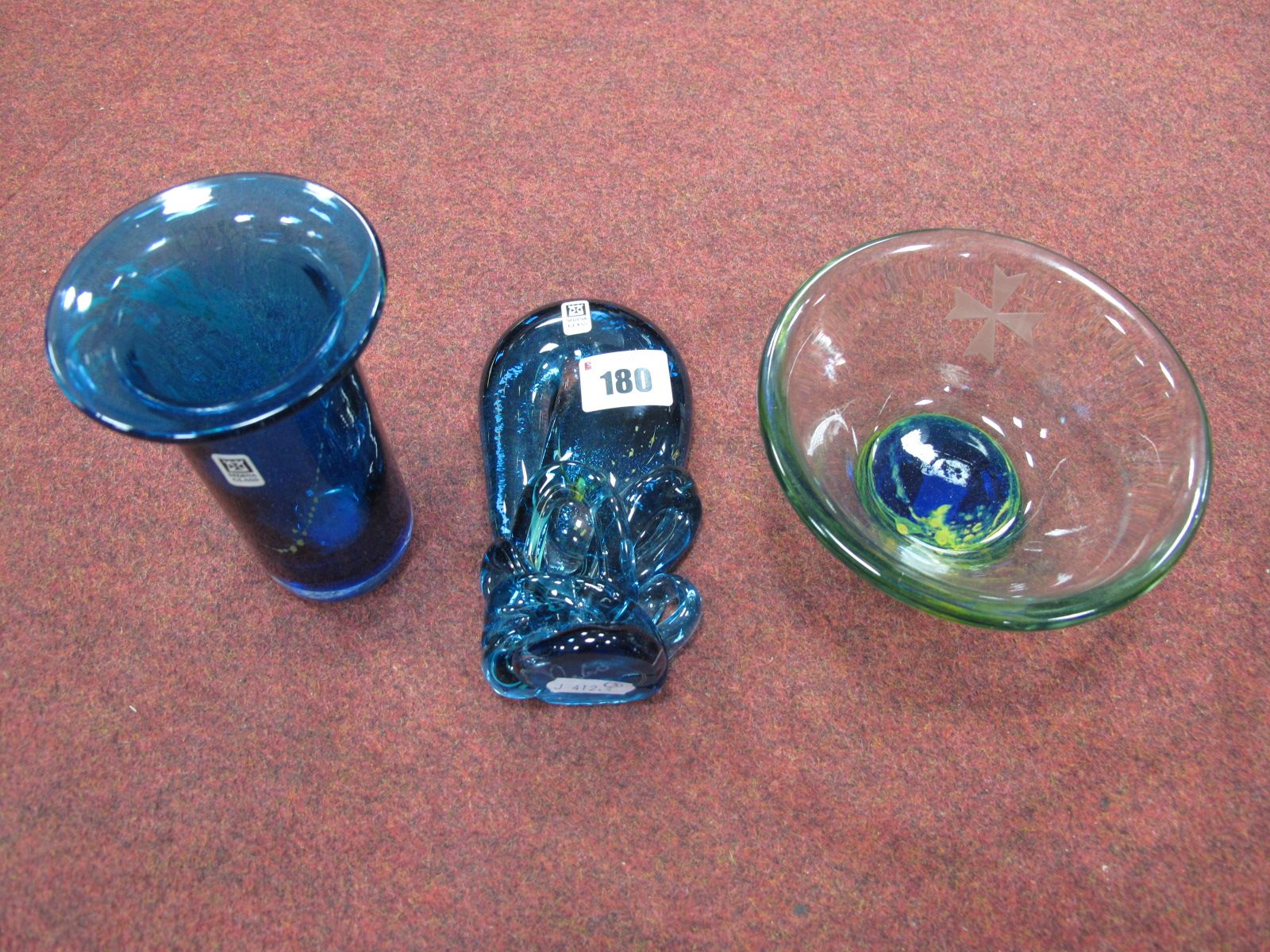 A Cylindrical Blue Vase, with flared rim, and an abstract ornament, both with Mdina Glass paper