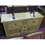 An Oak Sideboard, with dovetail top, two small drawers, three central drawers and cupboard doors.