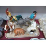 A Nymphenburg Pottery Pekingese, Tuscan parrot, Royal Doulton spaniel with pheasant HN1001, Brooks &