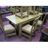 An Oak Rectangular Shaped Dining Table, with dovetail top, on square legs, together with six