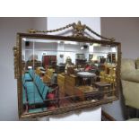 A Bevelled Rectangular Wall Mirror, in gilt frame, featuring vases and swags, 98cm wide.