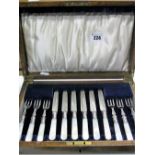 A Wooden Cased Set of Six Mother of Pearl Handled Knives and Forks, stamped "C.W.F" "EP".