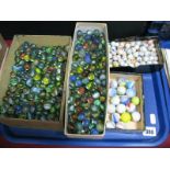 A Large Quantity of Marbles- four boxes including large pot and glass examples:- One Tray