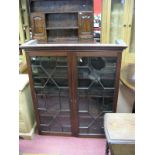 An XVIII Century Mahogany Bookcase Top, with a dentil cornice, astragal doors, three internal