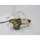 A Single Stone Diamond Ring, the old cut stone claw set on thin plain band, stamped "18ct".