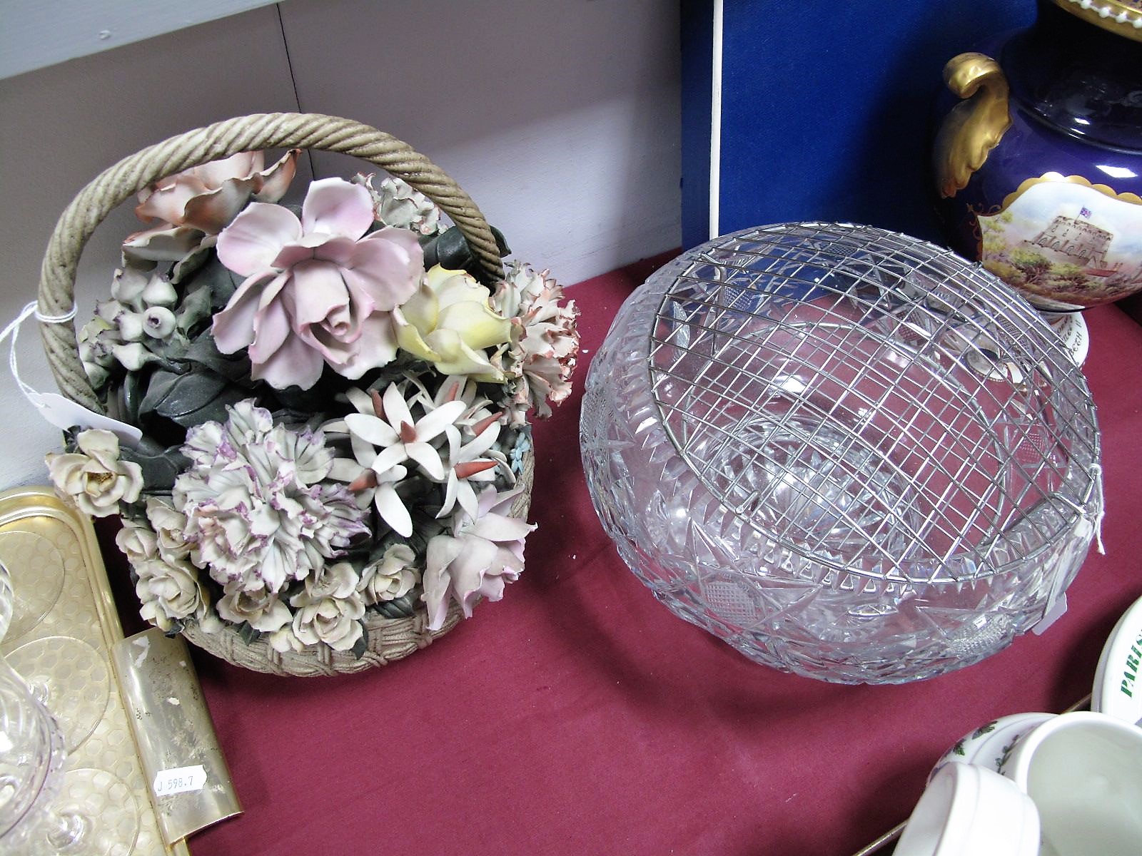 A Large Cut Glass Fruit Bowl, 25cm diameter, Capo Di Monte basket, 28cm high. (2)