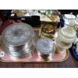 A Quantity of Plated Coasters, Azizoff mantel clock, Ronson lighter, alabaster jar and cover:- One