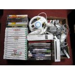 A Wii and Nintendo Gaming Console, with controls and accessories, together with over thirty Wii/PC