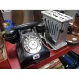 A Circa 1940's Black Bakelite Telephone, with slide tray, model 312F/C57/3A, and a vintage