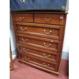 A Mahogany Effect Chest of Drawers, two short and four long, on bracket feet.