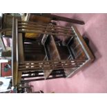 An Early XX Century Mahogany Revolving Bookcase, two tier, on 'X' base with brass castors.