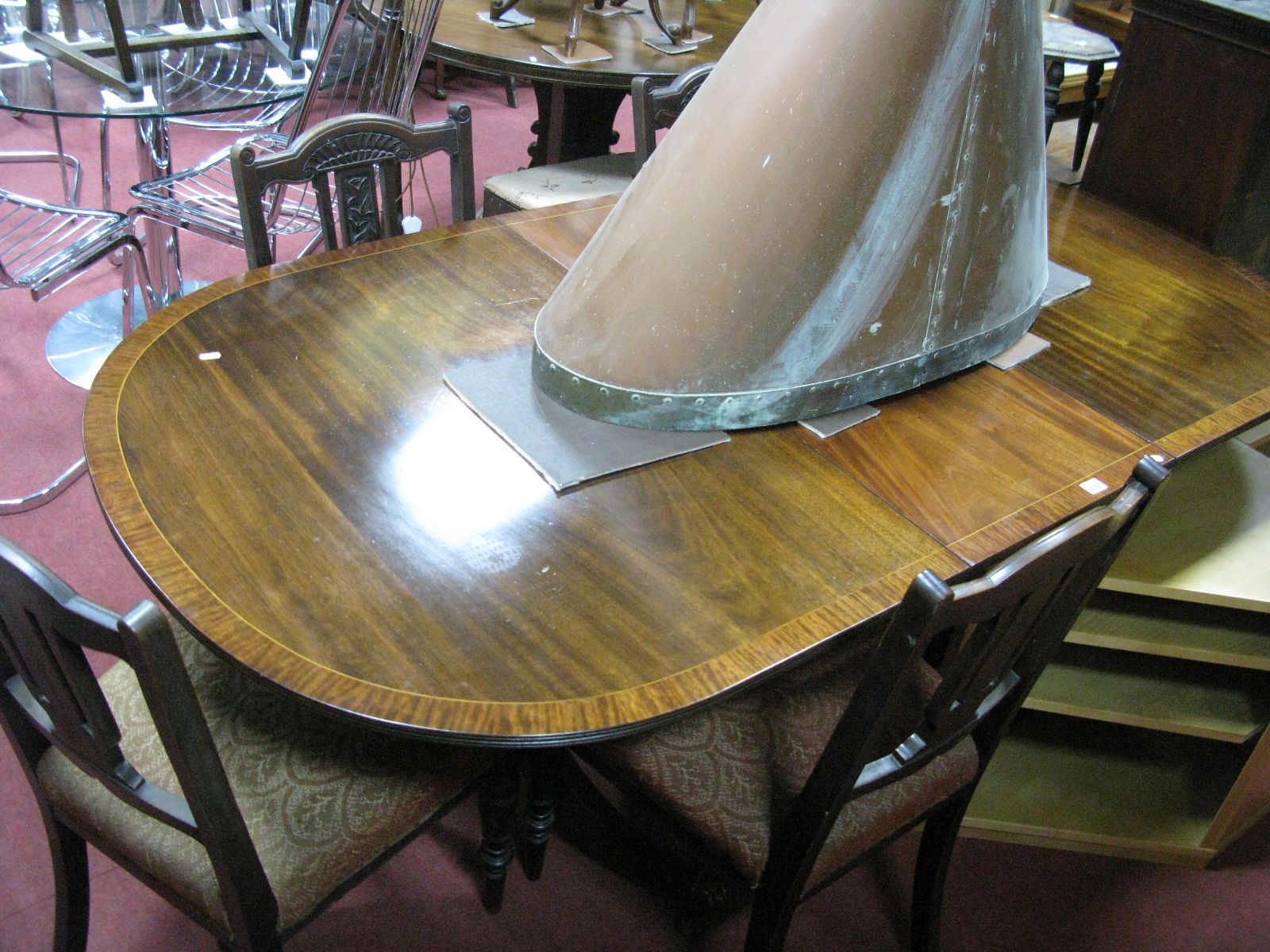 George III Style Mahogany Pedestal Table, with a crossbranded top, turned pedestal, swept and reeded