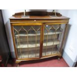 A 1920's Mahogany Bow Front Display Cabinet, with low back, gadrooned border, on ball and claw