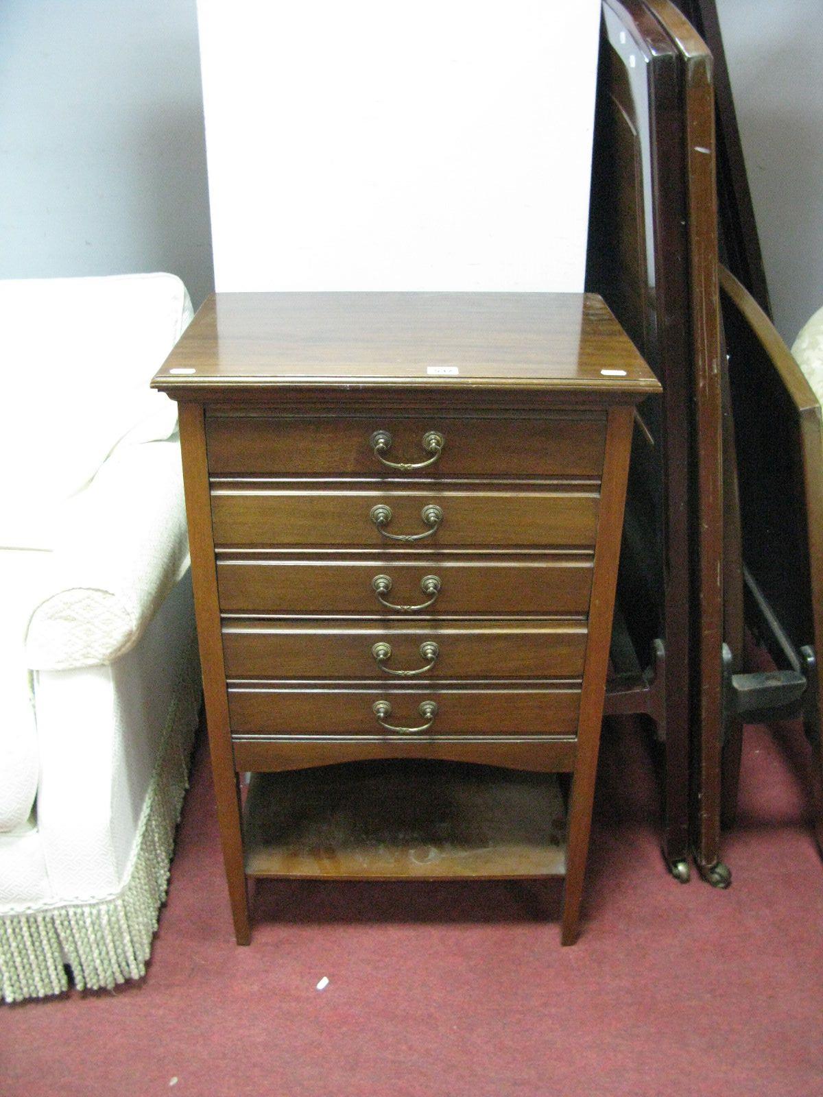 An Early XX Century Mahogany Five Drawer Music Cabinet, each with fall front, shaped apron piece