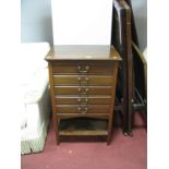 An Early XX Century Mahogany Five Drawer Music Cabinet, each with fall front, shaped apron piece