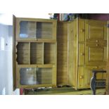 A Pine Kitchen Dresser, with a stepped cornice, open shelves, glazed doors, base with three small
