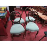 A Set of XIX Century Walnut Dining Chairs, each with pierced decoration to spoon back.