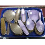 A Four Piece Hallmarked Silver Backed Dressing Table Set, plus a five piece silver mounted mauve