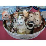 A Royal Doulton Penguin HN134 (chip to foot), seated kitten, Doulton kitten licking feet,