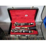 A Four Piece Console Special Clarinet, in fitted plush lined hard protective case.