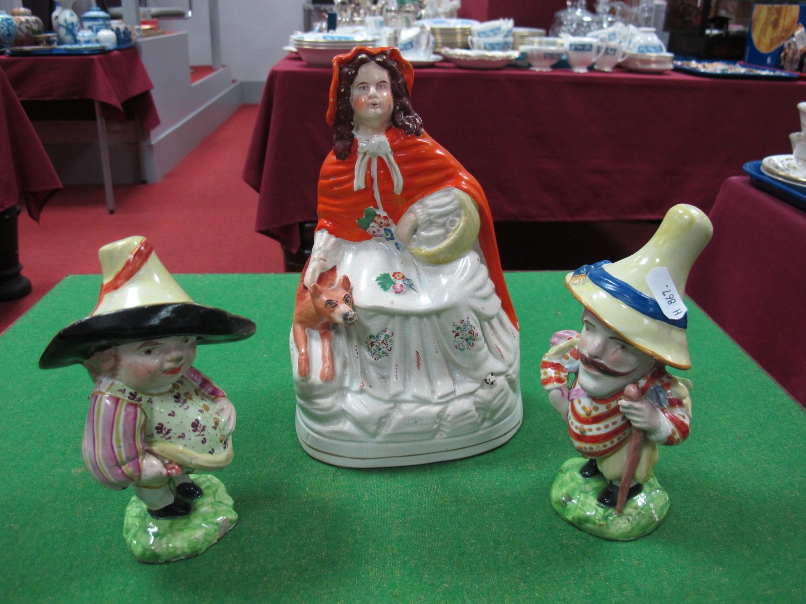 A Mid Victorian Staffordshire Flatback of Red Riding Hood including two glazed pottery "Mansion