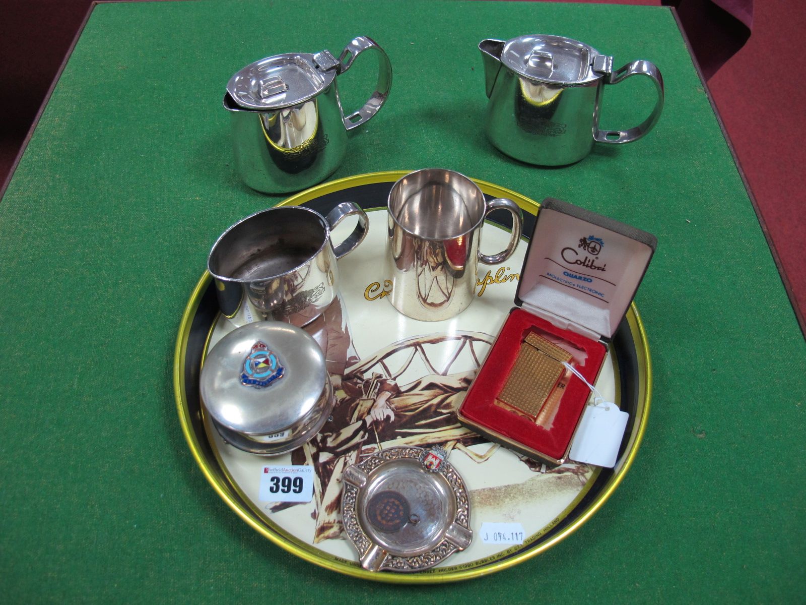 Colibri Lighter, S.S. Moldavia souvenir trinket box, a souvenir ashtray, a plated three piece tea