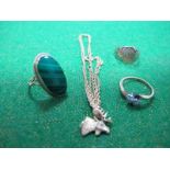 A Two Stone Ring, of crossover design, claw set; a signet style ring, a pendant on chain and a