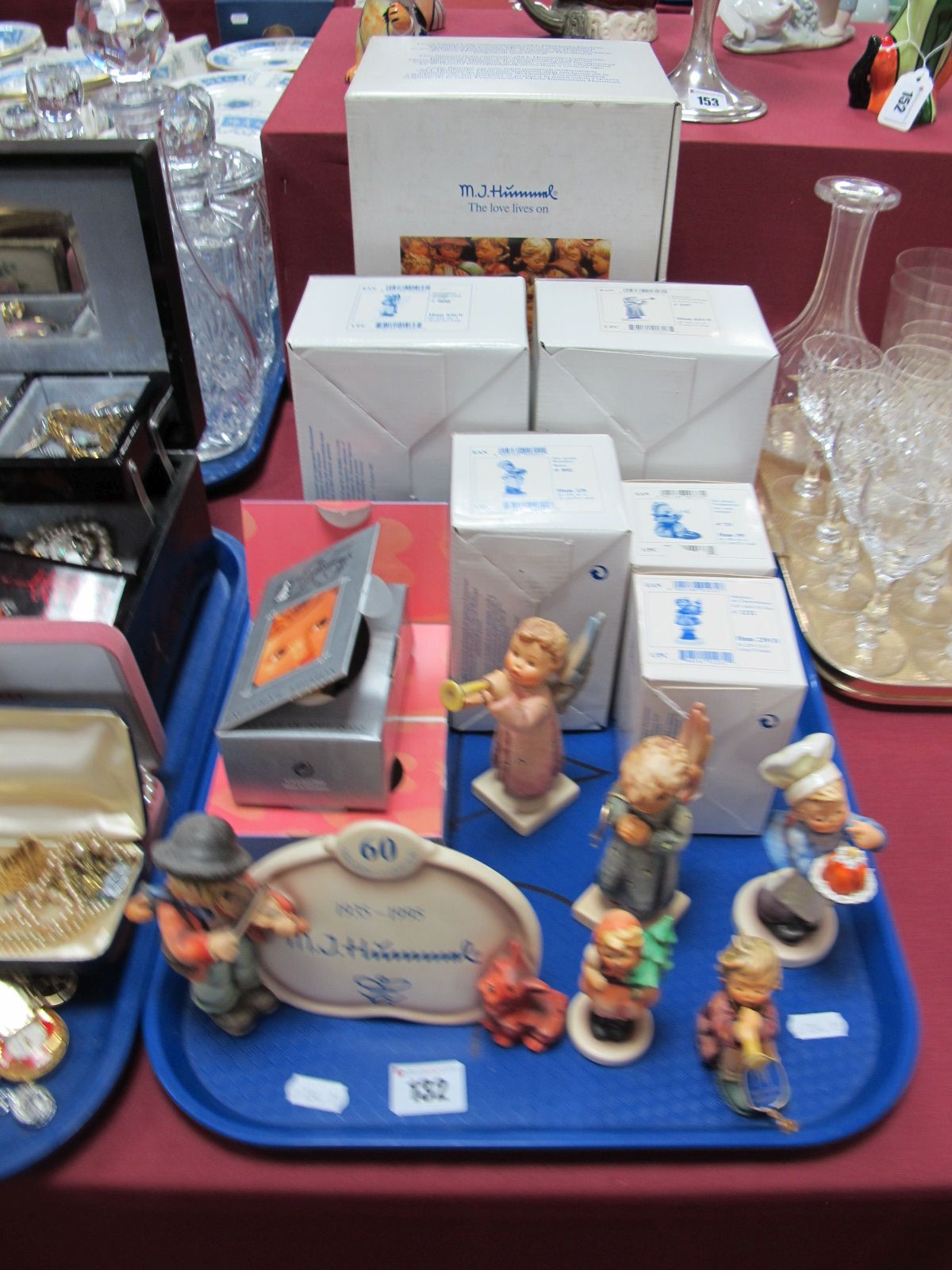 A Collection of Boxed Hummel Figures, including Display Plaque Puppy Love, Girl with Trumpet, Joyful