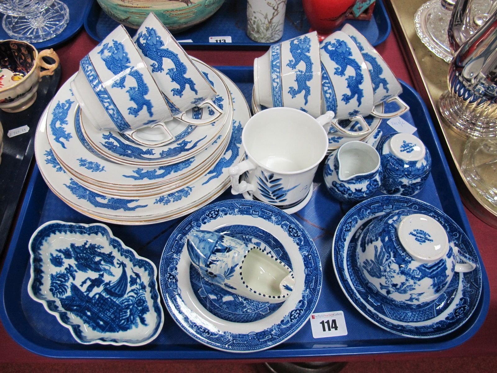 George Jones Crescent Dragon Pattern Tea Cups and Saucers, together with matching plates, Adderley