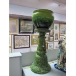 A Bretby Planter, green glaze, diameter 26cm, impressed factory mark to base, and a matched plant
