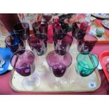 A Set of Ten Wine Glasses, amethyst bowl, faceted stems on circular spreading feet, and a green