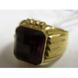 A Middle Eastern Style Gent's Single Stone Ring, rectangular collet set to the centre, between